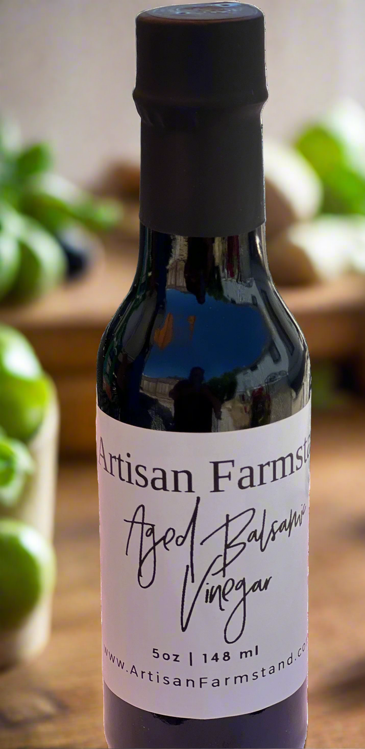 Aged Balsamic Vinegar bottle with rich, complex flavor notes of fig, cherry, and oak, ideal for salads, meats, and desserts.