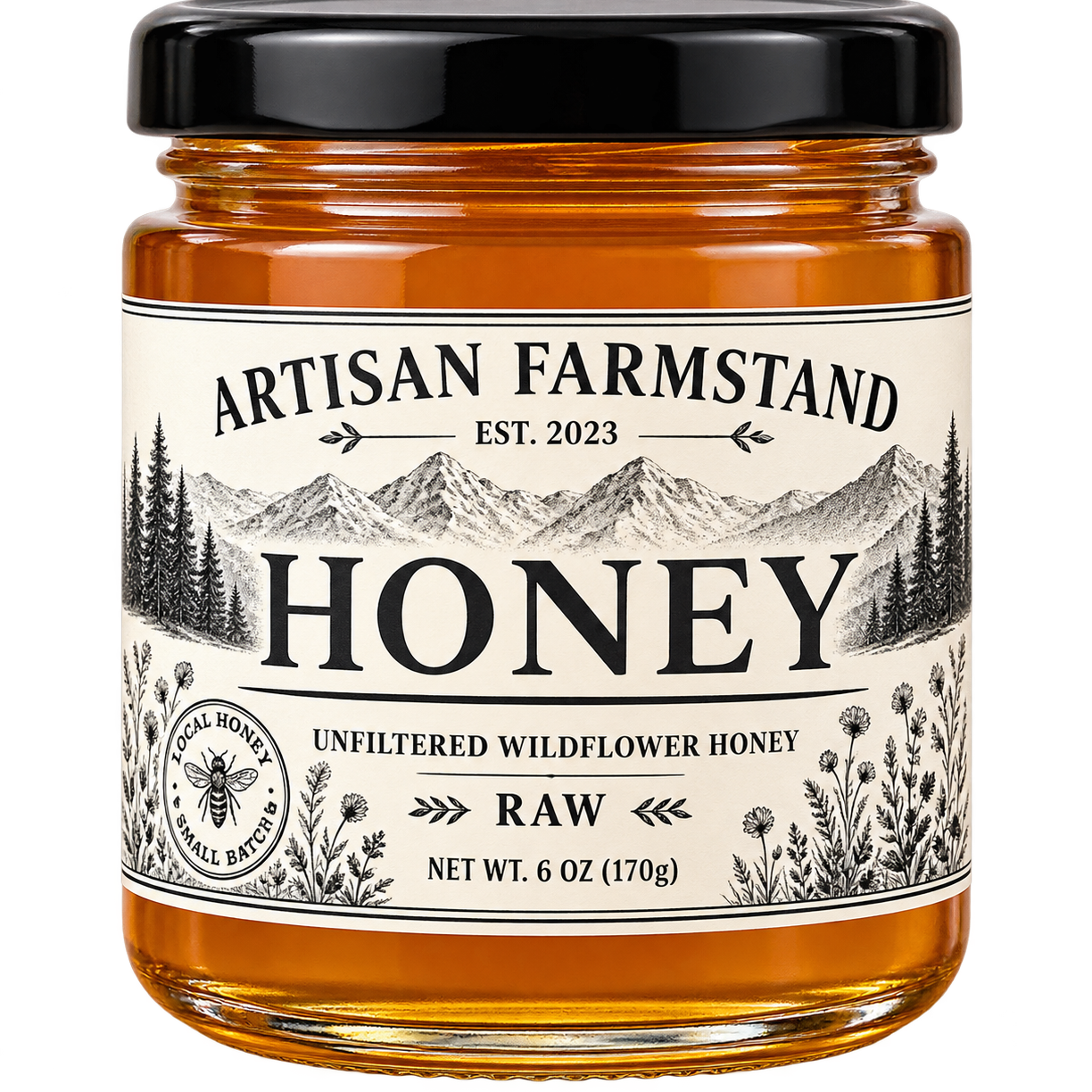 A glass jar of Artisan Farmstand Raw Honey with a black lid and a cream-colored label featuring a mountain and forest illustration.