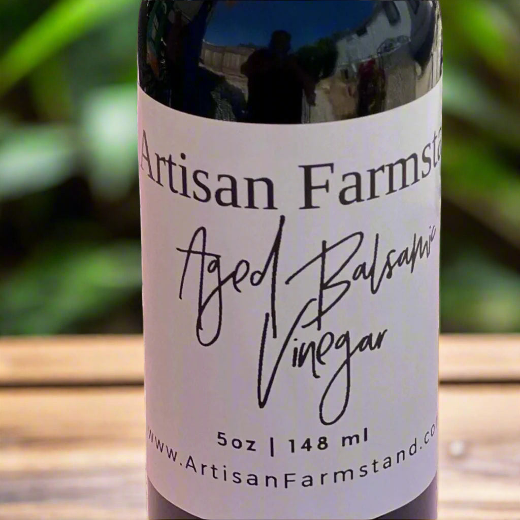 Aged Balsamic Vinegar bottle with rich, complex flavor notes of fig, cherry, and oak, ideal for salads, meats, and desserts.