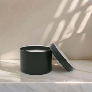Hand-poured, eco-friendly soy wax candle in an elegant black tin, perfect for a clean and long-lasting burn