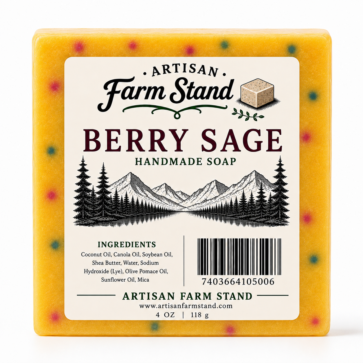 A square package of Artisan Farm Stand Berry Sage Handmade Soap, showing the front label with a mountain and pine tree illustration on a yellow-orange soap block with small berry specks.