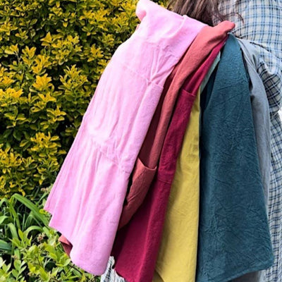 Handmade cross-back apron with deep pockets, durable fabric, and a comfortable fit for kitchen, gardening, or crafting